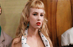 Video gif. Annoyed blond woman snarls her lip and rolls her eyes dramatically in frustration.