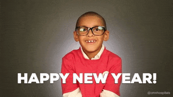 Video gif. Wearing a red t-shirt over a white long-sleeved shirt, a child with glasses cheerfully tosses confetti into the air. Text, "Happy New Year!"
