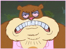 SpongeBob gif. Sandy the Squirrel as a large, monstrous beast with bloodshot eyes, puffs and snorts, livid.