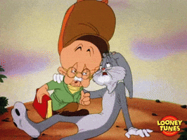 Cartoon gif. Elderly version of Elmer fudd from the Looney Toons kneels next to an elderly Bugs Bunny who lays on the ground. Bugs Bunny wails in agony, shaking his head, and Elmer Fudd listens intently to the rabbit. 