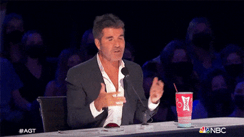 Celebrity gif. Simon Cowell of America’s Got Talent lifts his hands up in bewilderment and says, “I don’t know.”