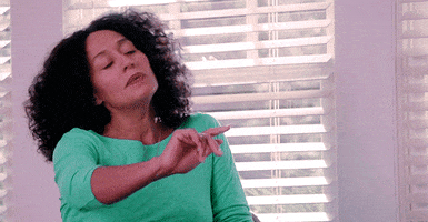 TV gif. Tracee Ellis Ross as Rainbow Johnson in Black-ish leans her head down and to the side with her eyes closed while holding up a hand as if to block something from her vision.