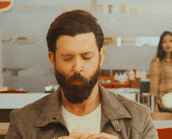 Ad gif. Deeply satisfied, actor Hrithik Roshan closes his eyes as he enjoys a bite of a burger from Burger King.