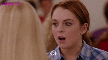Movie gif. Lindsay Lohan as Cady in Mean Girls shakes her head nervously and says, “Oh it’s okay…”