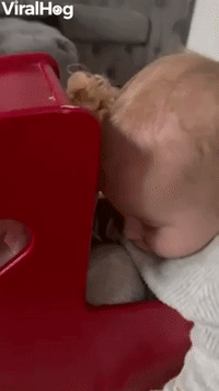 Baby Sleeps in Doll's Stroller