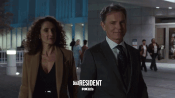 talking the resident GIF