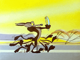 Cartoon gif. Wile E Coyote runs fast and eagerly down a road while holding a knife and fork in front of him.