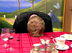 Video gif. Clearly frustrated, a man leans over and bangs his head repeatedly on a dining table.