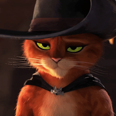 Movie gif. Puss in Boots from Puss in Boots The Last Wish shrugs apathetically, saying, "Eh."