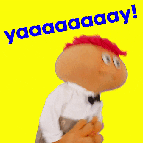 Video gif. Gerbert the puppet dances, claps, and says "Yay!"