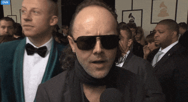 lars ulrich photobomb GIF by Daily Mail Online