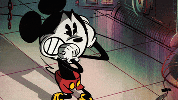 Disney gif. A trembling Mickey Mouse grits his teeth and braces himself in terror.