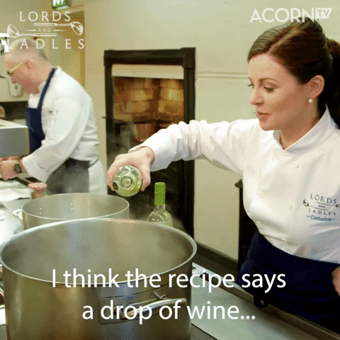 Reality TV gif. Catherine on Lords and Ladles stands in a kitchen and generously pours a bottle of white wine into a large pot. Text, "I think the recipe says a drop if wine..."