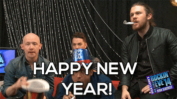 TV gif. The band, The Fray, are on New Year’s Rockin’ Eve. One of the band members jumps up in excitement while the rest blow on party horns. Text, “Happy New Year!” 