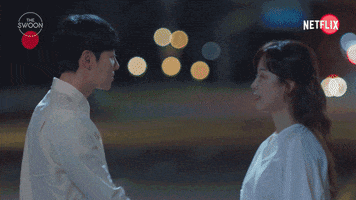 TV gif. Seo Hyun-jin as Kang Da-jeong and Kim Dong-wook as Ju Yeong-do in You Are My Spring step closer together as they embrace with a kiss and we cut to closeups their faces.