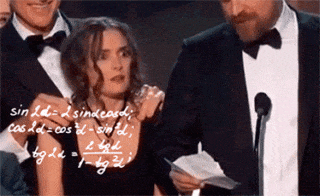 Celebrity gif. Actress Winona Ryder stands on stage with other presenters at an awards show. Her eyes dart around as she struggles in confusion. Math equations dance over her head as she puzzles out her thoughts. 