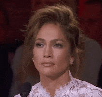 Reality TV gif. Jennifer Lopez on American Idol shakes her head and blinks her eyes as if she were in complete disagreement. 