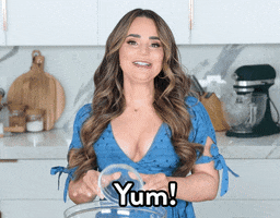 Video gif. Rosanna Pansino smiles as she overturns a small glass bowl into a larger one and says, "yum!"
