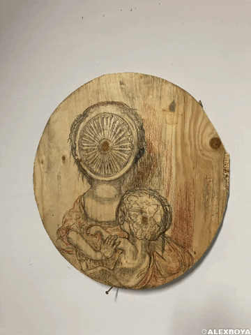 Photo gif. Sketched upon a circular wood slab, a mother holds her baby, but her face has been swallowed up by a turbine. The baby's brain can be seen through the top of his head.