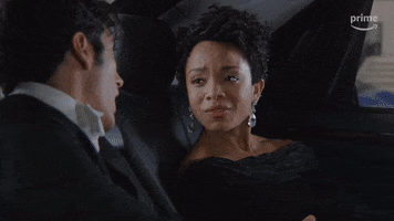 TV gif. Rachel Hilson as Nora in "Red, White and Royal Blue" sits in the back of a car, looking over at Alex Ozerov as Malcolm with concern. Text, "Are you crazy?'