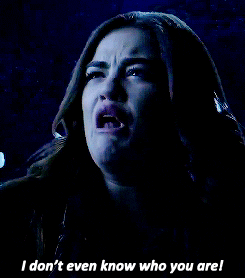 TV gif. Looking betrayed, Lucy Hale, as Aria in Pretty Little Liars cries, “I don’t even know who you are!”