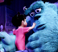 Movie gif. A worried Sully from Monsters, Inc looks away from Boo as they hug.