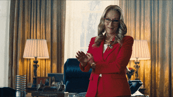 Movie gif. Meryl Streep as President Orlean in Don't Look Up points a finger gun with a sordid smirk.