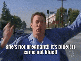 TV gif. John C. McGinley as Perry Cox on Scrubs runs down the middle of a busy road in his pajamas, waving his arms around in excitement. He takes off his robe and waves it around until he tosses it into traffic. He yells, “She’s not pregnant!! It’s blue!! It came out blue!!”