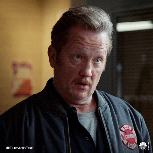 TV gif. Christian Stolte as Mouch in Chicago Fire looks very shocked as his mouth hangs open, his eyebrows lifted high on his forehead.