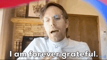 TV gif. From the GLAAD awards 2021, a man in a white shirt with an ascot speaks to us sincerely with fingers linked. Text, "I am forever grateful."
