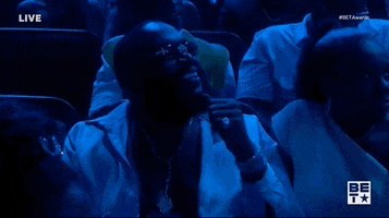 TV gif. A man in the audience at the BET Awards has his hand on his chin while he yells out, “Facts!” The people around him nod.