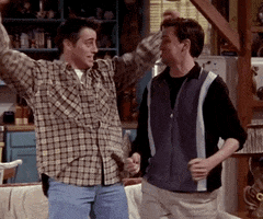 Friends gif. Matt LeBlanc and Matthew Perry as Joey and Chandler are both excited, doing goofy happy dances.