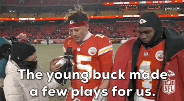 Sports gif. Patrick Mahomes and Rashee Rice of the Kansas City Chiefs are being interviewed after the game. Mahomes nudges Rice and says, "The young buck made a few plays for us."
