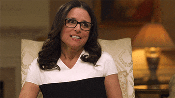 Celebrity gif. Julia Louis-Dreyfus scrunches up her face and squints upwards in contemplation.