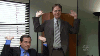 The Office gif. Steve Carell as Michael and Rainn Wilson as Dwight bob their heads as they pump their hands in the air like they are raising the roof in celebration. 