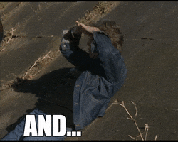Celebrity gif. Musician Paul McCartney stretches out his arms and lays back on the ground. Text, "And...relax!"