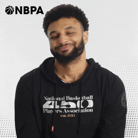 Video gif. Jamal Murray of the Denver Nuggets poses for a NBA Players Association ad, smiling and nodding his head as text flies in, "Nah."