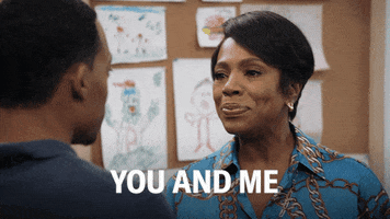 TV gif. Sheryl Lee Ralph as Barbara in Abbott Elementary points toward Tyler James Williams as Gregory, then back at herself as she narrows her eyes and says, "You and me."