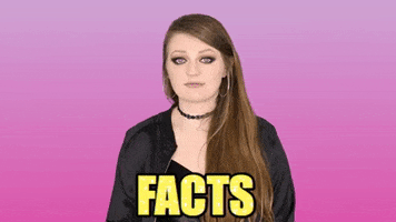 Celebrity gif. Kathryn Dean looks at us with a serious smile and points as she says, "Facts."