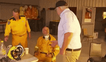 news australia awkward firefighter hand shake GIF