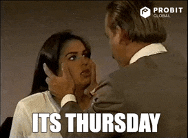 TV gif. A scene from a telenovela. We zoom in on the face of a shocked woman. The sides of her face are being held and lightly shaken by a man in the foreground. The woman faints. Text, "It's Thursday."