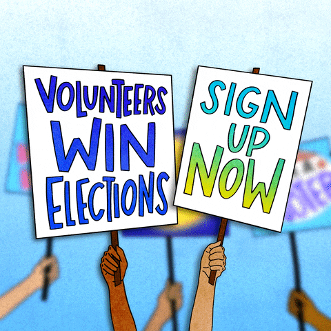 Illustrated gif. Hands holding up picket signs, the crowd out of focus behind them. Text, "Volunteers win elections," "Sign up now."