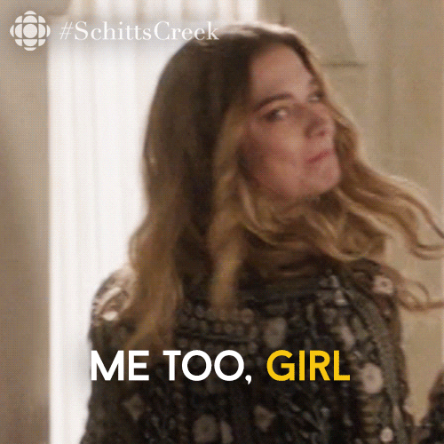 Schitt's Creek gif. Annie Murphy as Alexis smiles as she looks over her shoulder on her way out the door, winking and makes a kissy face. Text, "Me too, girl." 