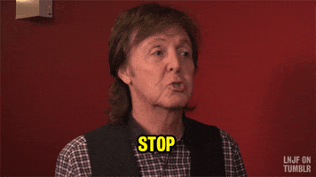 Tonight Show gif. Paul McCartney waves his pointer finger and says, “Stop.”
