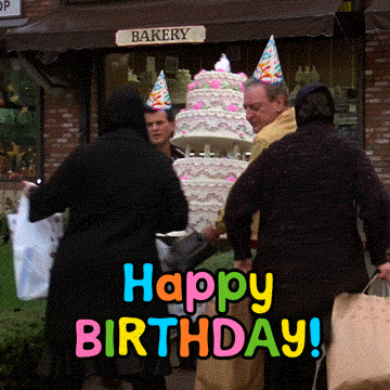 Video gif. Two men in party hats carrying a giant multi-tiered pink and white cake away from a bakery, kicking away anyone in their path as people fall around them. Text, "Happy birthday!'