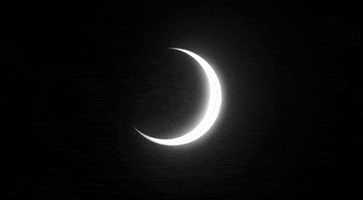 Video gif. A timelapse of the moon slowly covering the sun to create an eclipse. 