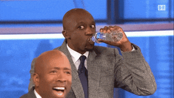 Sports gif. Jason Terry in the Bleacher Report side-eyes while drinking water, shaking his head as he sets the bottle down.