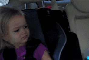 Meme gif. Young blonde girl, Chloe, in a car seat looks at us with a judgmental or disapproving side-eyed expression, darting her eyes back and forth like she doesn't get what you're about at all.