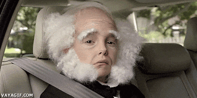 Video gif. A child sits in the backseat of a car with the window down. He looks sadly out the window and his face is full of wrinkles. He has white hair and a large white beard, which is shaved on the chin, in the civil war era style.