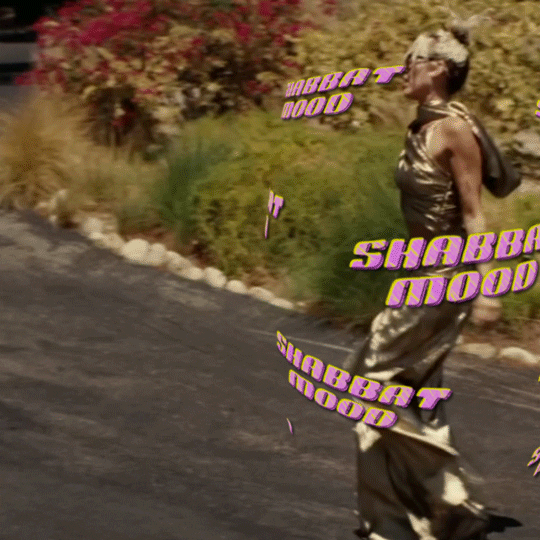 Text gif. Wallpaper print forcefield of the phrase "Shabbat mood" in a neo-Y2K font, circulating around Miley Cyrus young prancing and grooving through a nature scene in the "Flowers" music video.